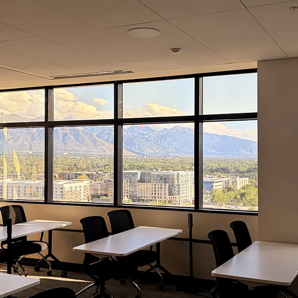 Commercial window cleaning with a view of the Wasatch mountains