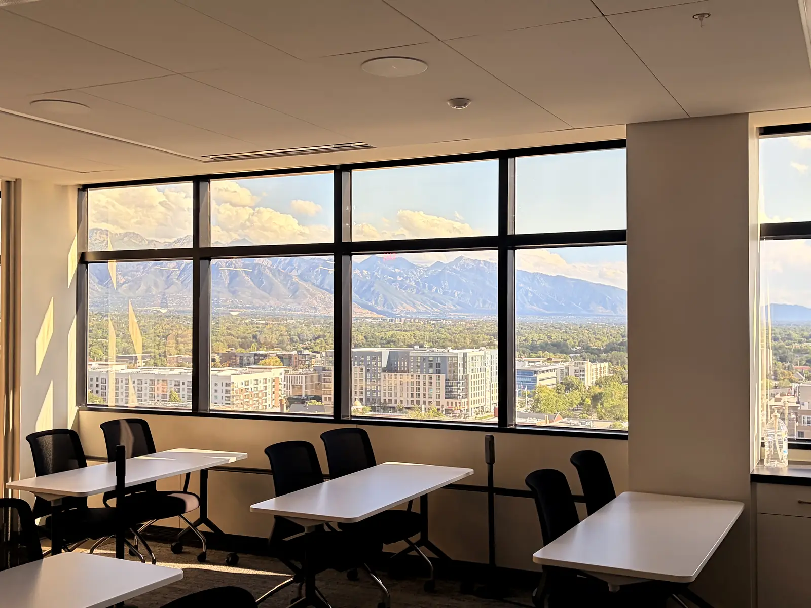 Commercial window cleaning with a view of the Wasatch mountains
