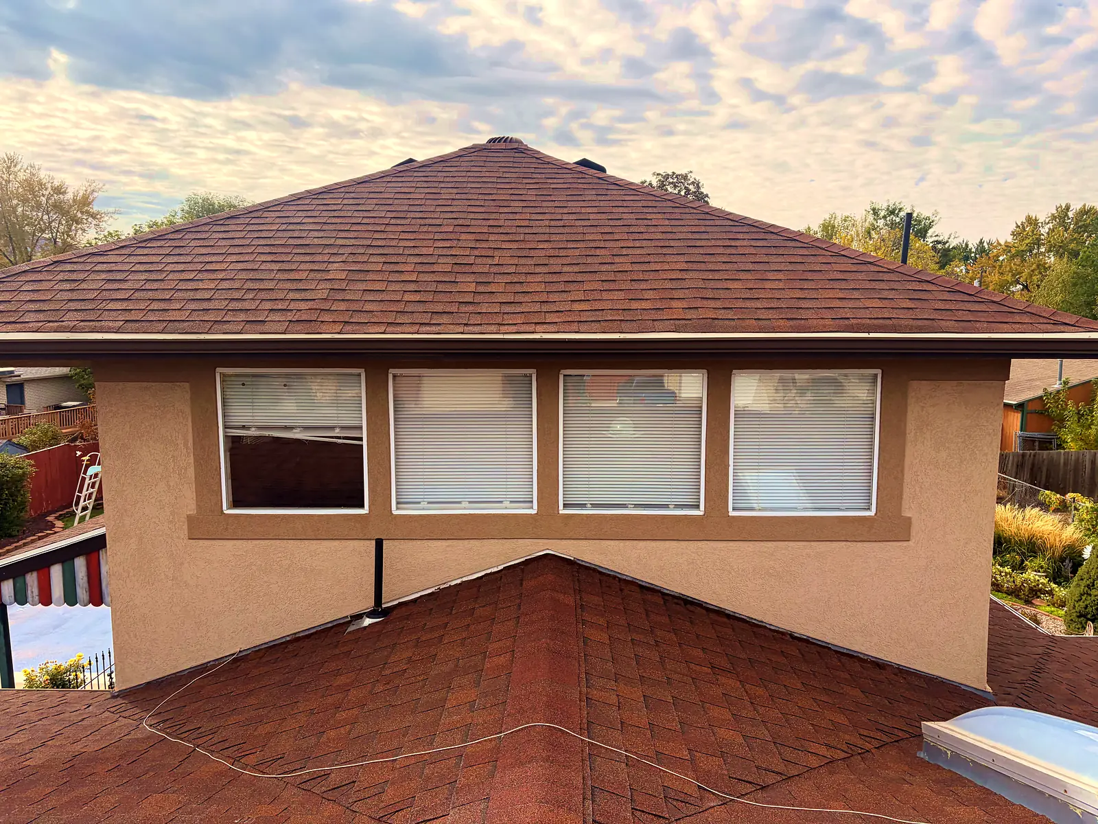 Second-story windows cleaned from the roof